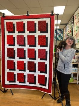 coral red black white quilt with Livvy