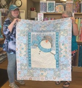 val-schilds-flannel-baby-quilt-in-blues-and-tans