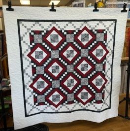 cheryl-sebastion-red-white-grey-accents-square-quilt