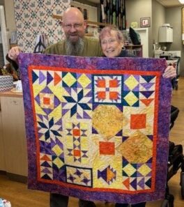 joan-frazier-yellow-purple-sample-star-quilt-with-bill